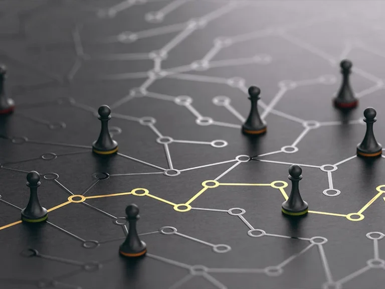 Chess pieces connected by strategic pathways