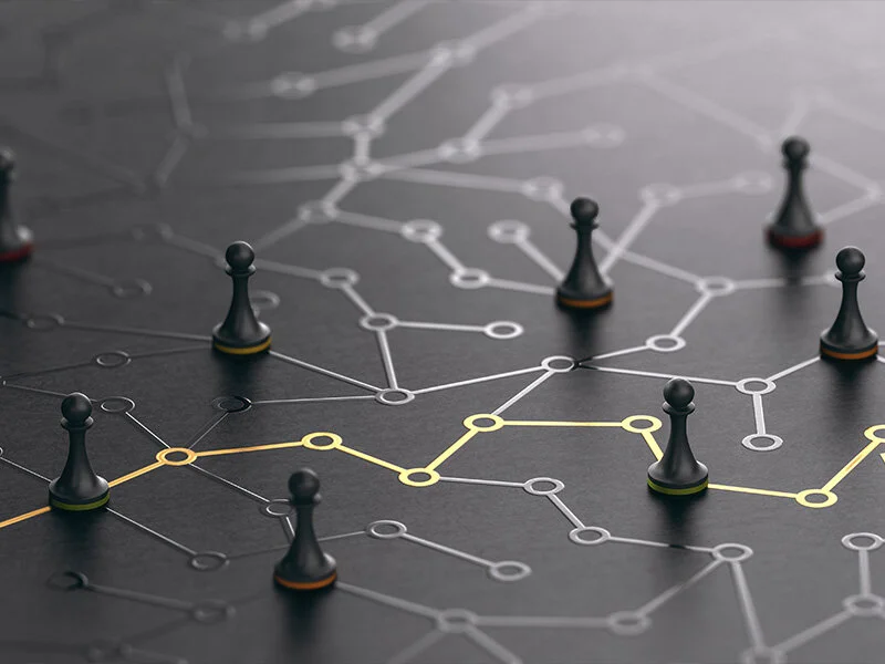 Chess pieces connected by strategic pathways
