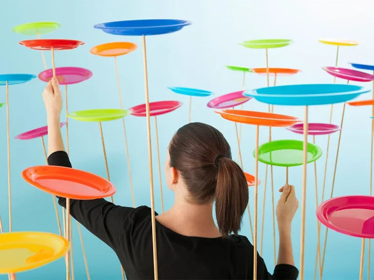 Woman balancing multiple spinning plates