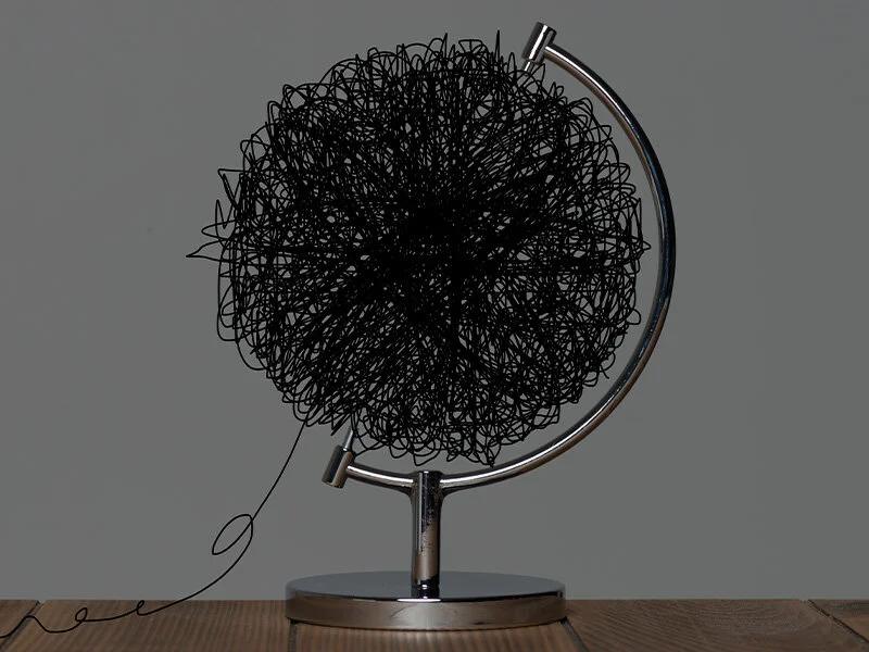 Tangled globe representing business disruption and uncertainty