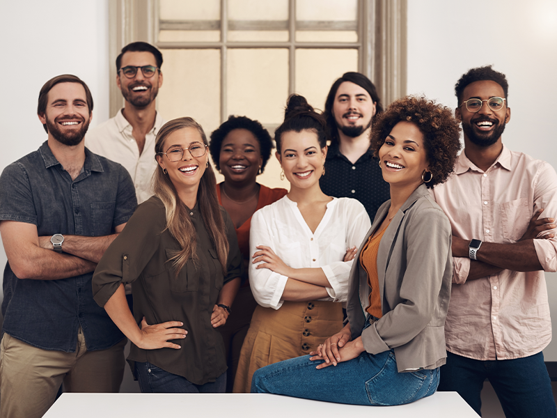 Diverse group of employees standing together